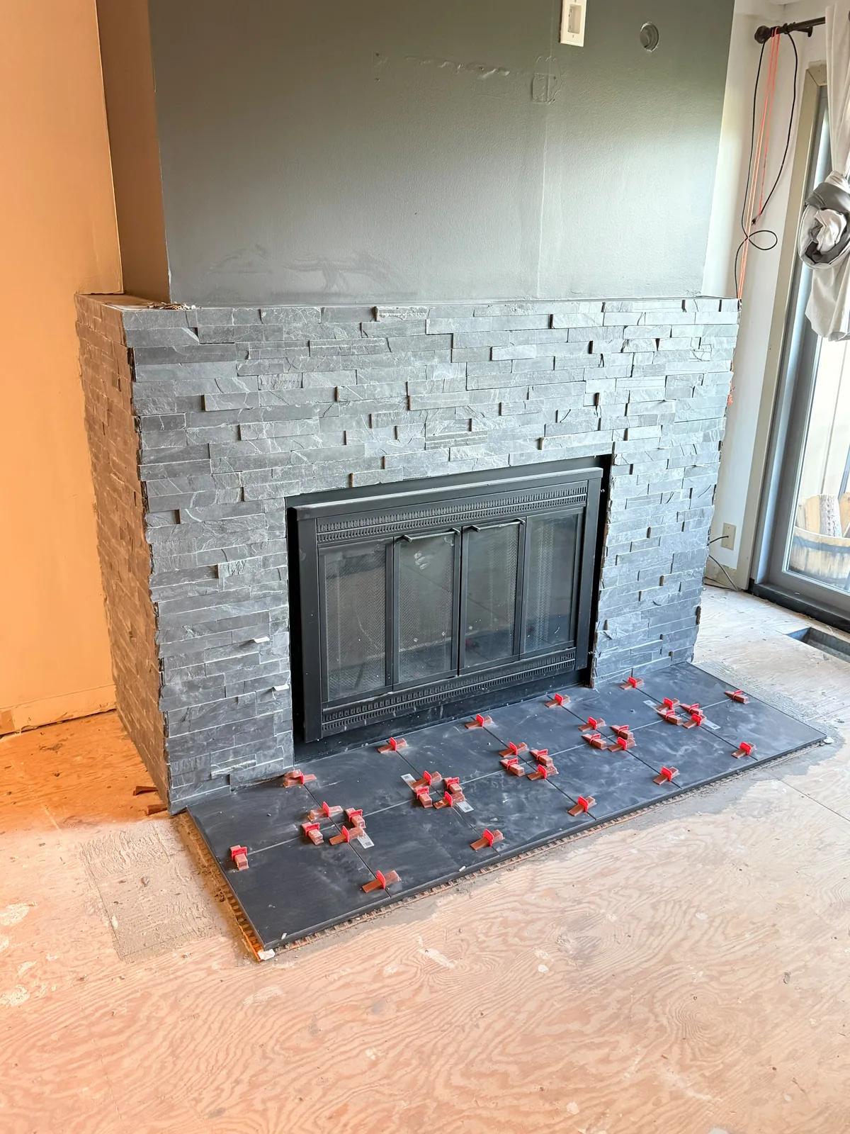Slate fireplace surround mid-installation
